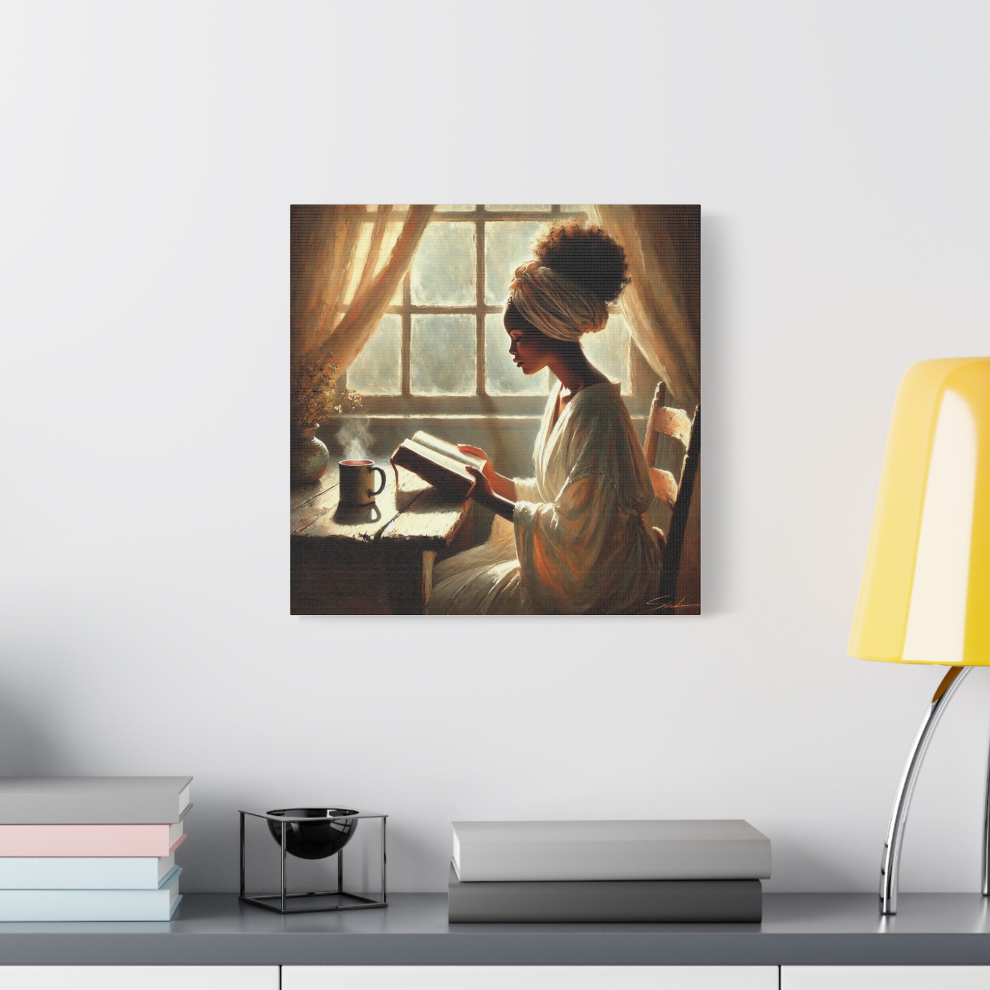 Canvas print of a woman reading a book by a window on a wall above a shelf.